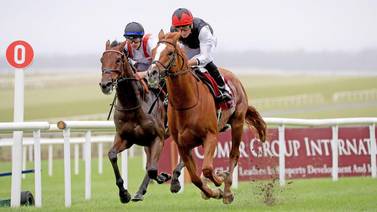 Kyprios ridden by Ryan Moore leads Hamish ridden by Richard Kingscote to win the Comer Group International Irish St. Leger