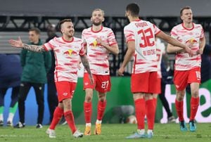LEIPZIG, GERMANY - APRIL 28: Angelino of RB Leipzig celebrates with teammates after scoring their team's first goal during the UEFA Europa League Semi Final Leg One match between RB Leipzig and Rangers at Football Arena Leipzig on April 28, 2022 in Leipzig, Germany. (Photo by Martin Rose/Getty Images)